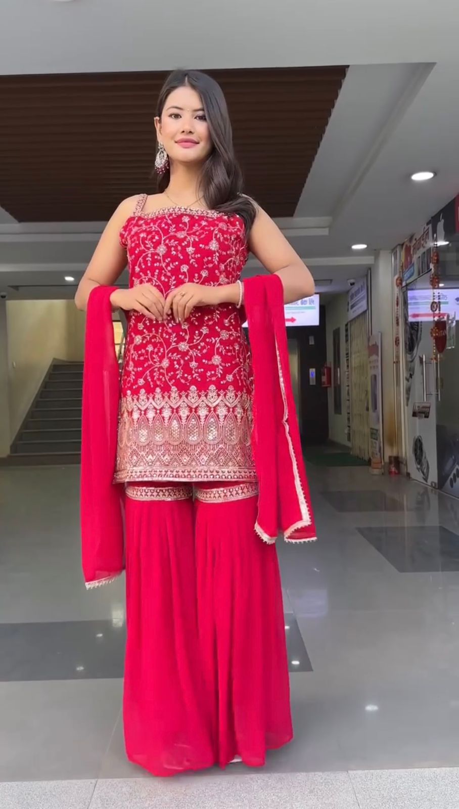 Elegant Red Traditional Ensemble with Intricate Embroidery