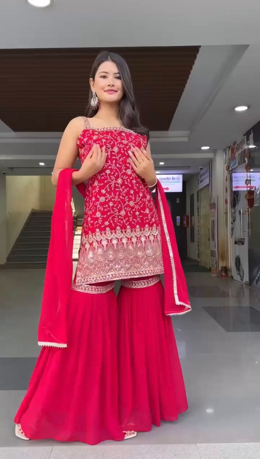 Elegant Red Traditional Ensemble with Intricate Embroidery