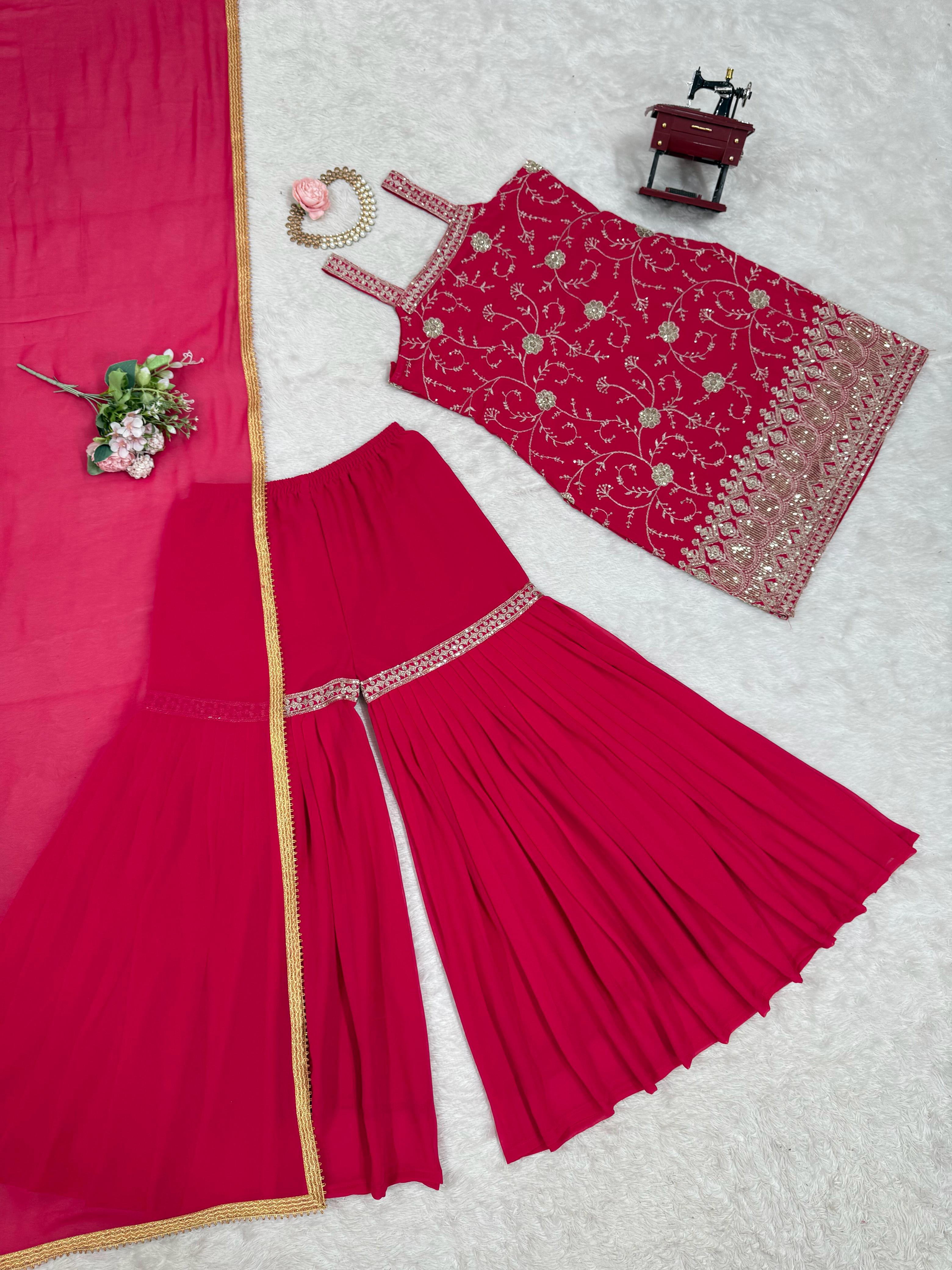 Elegant Red Traditional Ensemble with Intricate Embroidery
